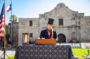 Reenactor Sam Haynie reads aloud from the famous "Travis Letter" written by Alamo Commander William Barret Travis, which called for outside aid to come to the surrounded fortress