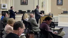 Fayette Mental Health Court Administrator Bill Buckman at the podium-Fayette District Judge John Tackett standing behind him.  05-13-24
