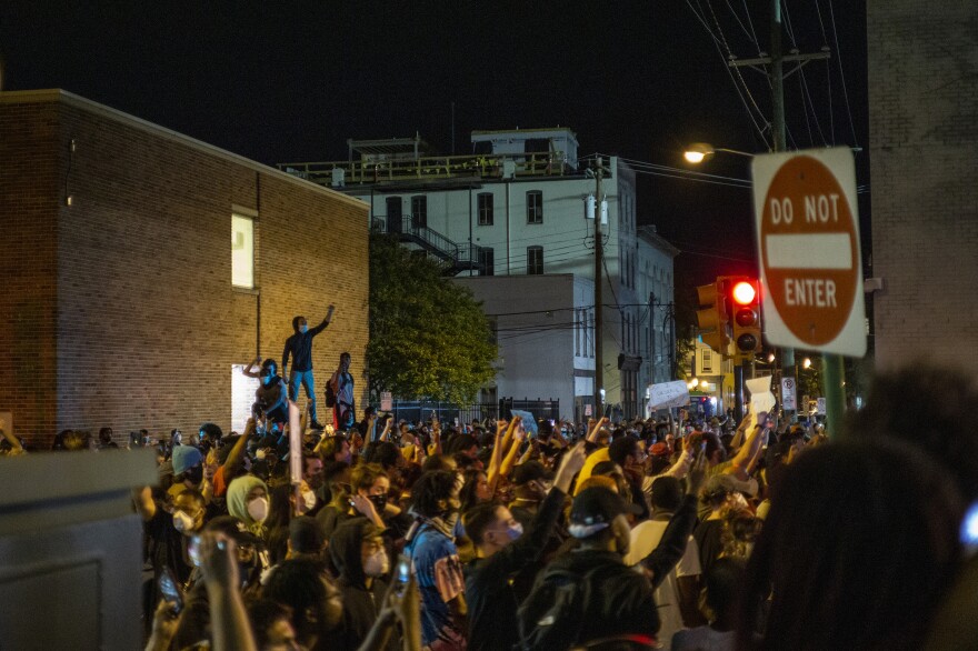 Protesters gather in Richmond, Va., on Saturday night.