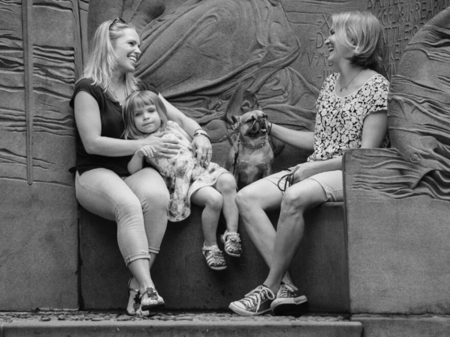 Jaimie Kelton, 39, poses with her wife and their daughter.