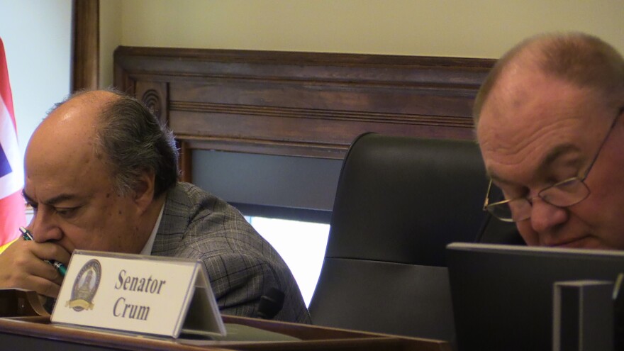 2 people looking down at their desks