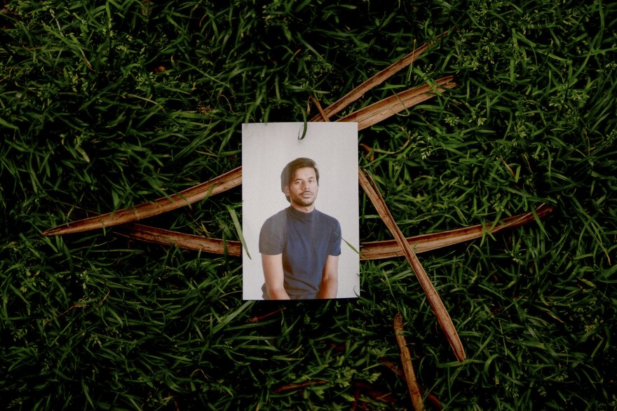 Self portrait, Washington Square Park, New York City, May 2022. Amir's Bengali nickname "Sobuj" means green, like the color of the grass that frames his photo.