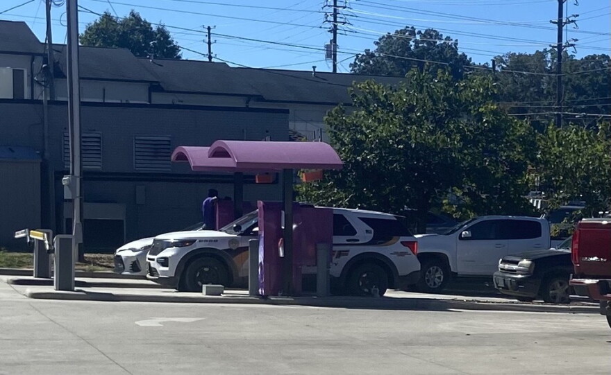 Vehicles lined up at Heroes Car Wash