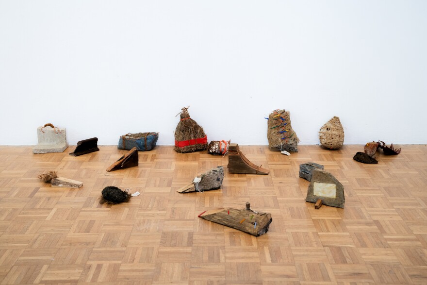 Doorstops crafted from reclaimed materials by Kainoa Gruspe, on exhibit at the Whitney Biennial from March 8 to April 23, 2026.
