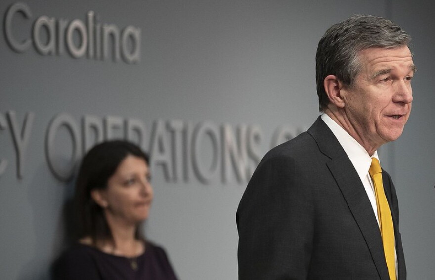 File photo of N.C. Governor Roy Cooper and N.C. Department of Health and Human Services Secretary Dr. Mandy Cohen.