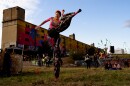 Margaret “Mega Legs” Wilson, 42, of Carondolet, dances on Sunday, Oct. 8, 2023, during the Artica Urban Art Festival along the Mississippi Riverfront in downtown St. Louis.