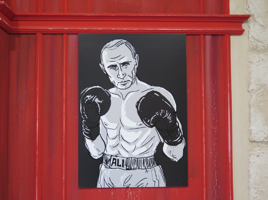 Putin was also depicted as Muhammad Ali.