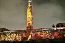 Liberty Memorial lit colorfully with classic-looking characters