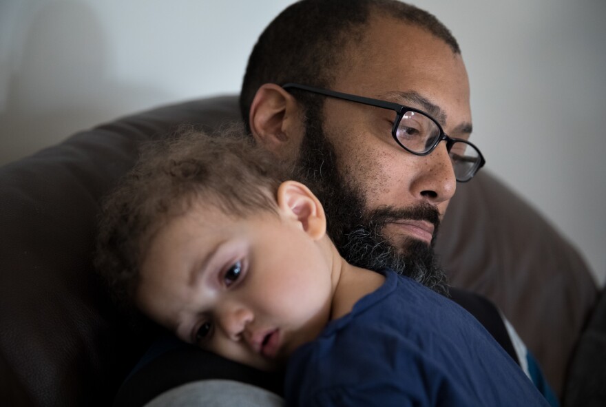 Donerson cuddles daughter Tricia, 1.