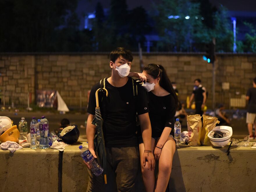 Demonstrators rest the night after protests against Hong Kong's controversial proposed extradition law late Wednesday.