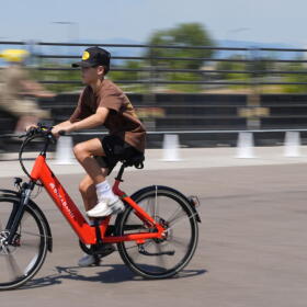 A visitor guides an electric bicycle around a test track at the Electrify Expo, Sunday, July 14, 2024, in north Denver. (David Zalubowski/AP)