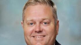 A headshot of David Mouser