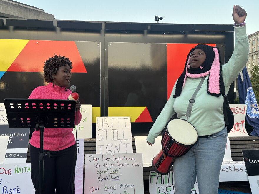 28-year-old Winslande Hensley (r) and Michael Louis (l) lead marchers in upbeat songs before they walk 40 miles to Columbus.