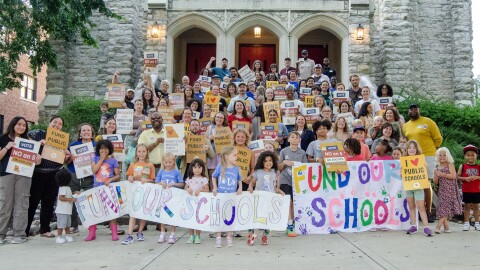 Dozens of Kansas City area parents, educators and community members rallied against a proposed constitutional amendment that would eventually eliminate the state income tax.