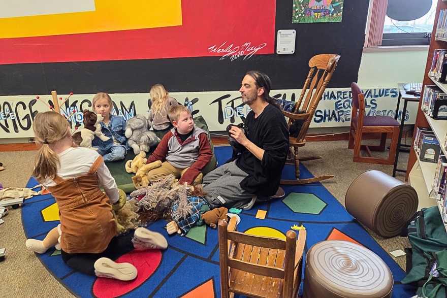 Children's Librarian Michael Lyons plays with puppets with some of the Bemidji Public Library's youngest patrons during his send-off celebration on March 27, 2026.