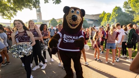 Boomer Bear, Missouri State University Mascot walking on campus with students and community members during the 2025 Party in the CUSA Block Party