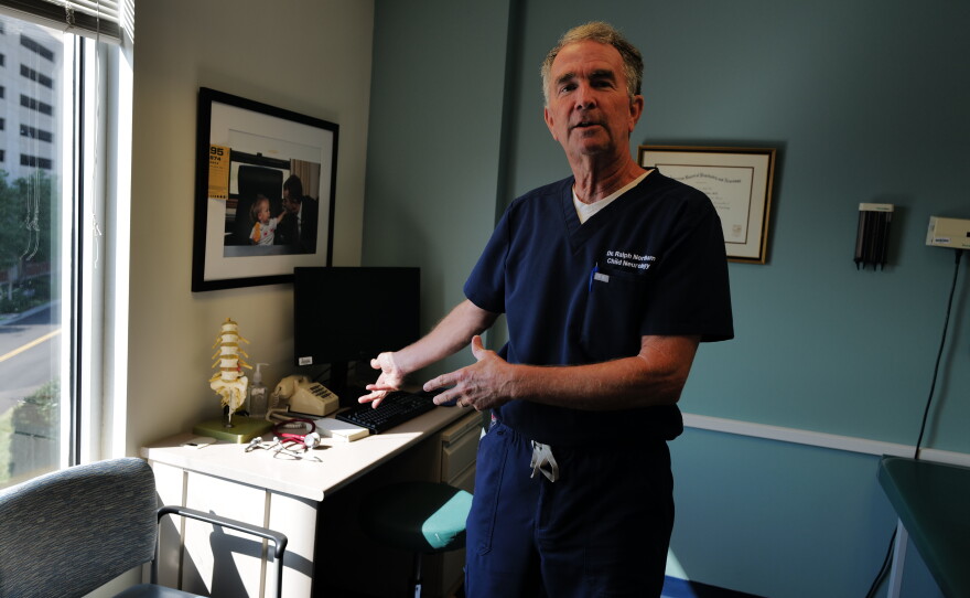 Ralph Northam shows the desk in his exam room.