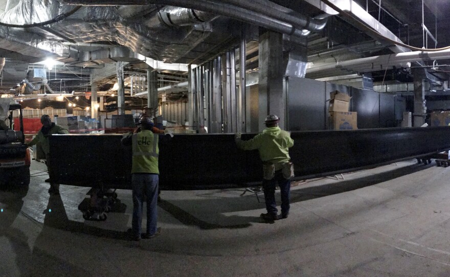 Eight 12,000-pound steel beams were lifted into place from below rather than lowered from above. The beams were installed above the Children's Museum to help support the front plaza and driveway. The originals were compromised by 84 years of water damage.