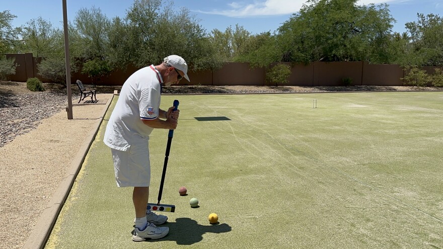 Paul Bennett playing croquet.