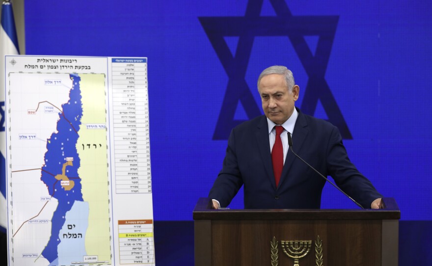 Netanyahu tells reporters on Sept. 10 in Tel Aviv that he will annex West Bank settlements if he wins the national elections.