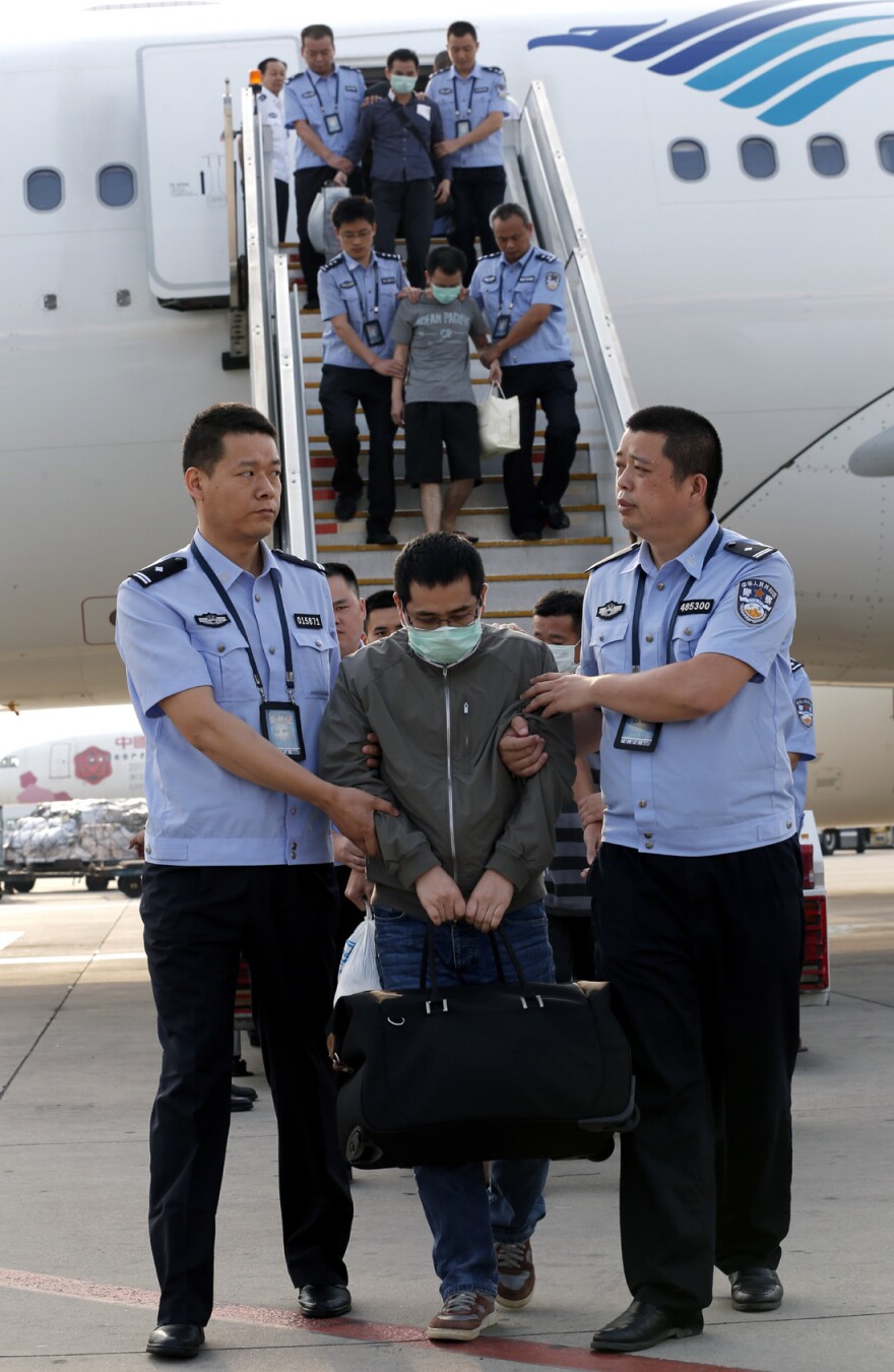 China has launched a major program to arrest suspects who have fled abroad. Six fugitives were brought back from Indonesia to the Capital International Airport in Beijing on Sunday.