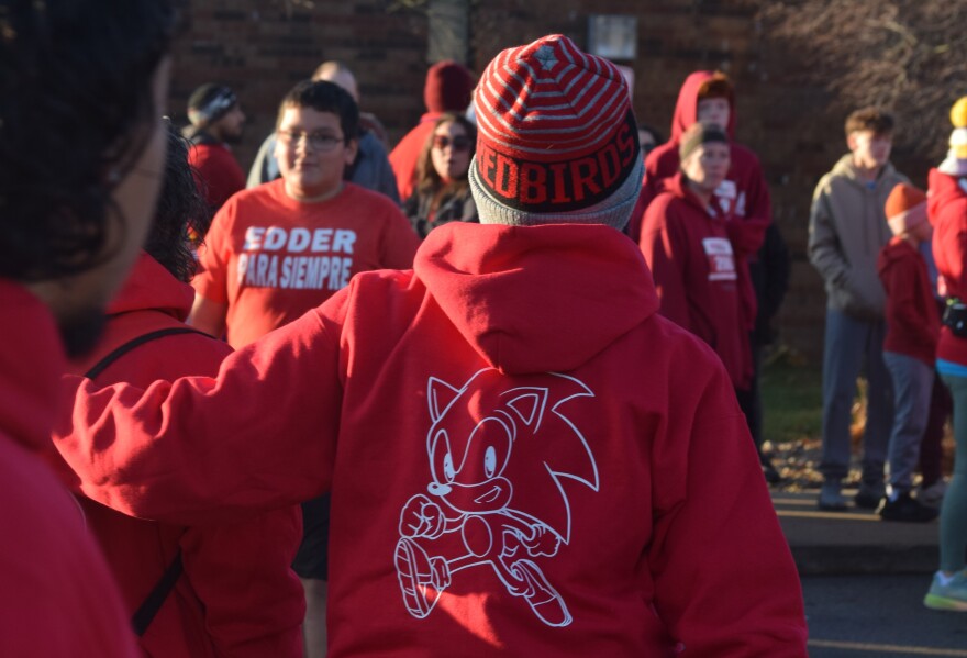 The Bloomington-Normal community showed up in red Saturday, Nov. 22, 2025, to honor Edder Diaz, a Parkside Junior High School seventh-grader who died Nov. 8, from injuries he'd suffered in a Nov. 2 home fire. The morning events included a Gift of Hope flag-raising ceremony, to recognize Edder as an organ donor, and the Redder for Edder Walk/Run, a fundraiser for the Diaz family. The race drew more than 800 registrations, organizers said. Edder's favorite color was red, and he was a fan of the cartoon character Sonic the Hedgehog, displayed on the back of many sweatshirts in the crowd.