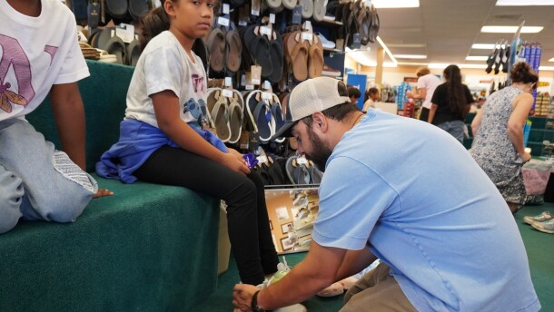 Immokalee children get new shoes through the Laces of Love program. Staff members at Snyderman's Shoes in Naples recently fitted the kids with footwear.