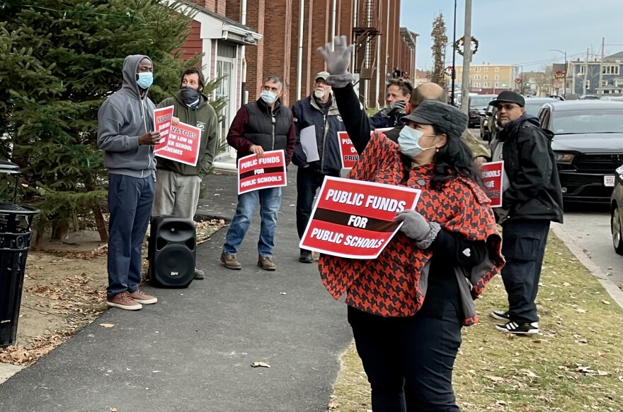 Opponents of the proposed Innovators Charter School demonstrated outside of a public hearing Wednesday in New Bedford.