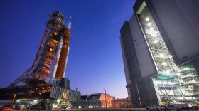 FILE - NASA's Artemis II SLS (Space Launch System) moon rocket, with the Orion spacecraft abaoard, slowly rolls back towards the Vehicle Assembly Building at the Kennedy Space Center, Feb. 25, 2026, in Cape Canaveral, Fla. (AP Photo/John Raoux, File)