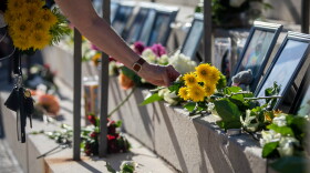 Flowers are placed at a memorial at the Texas State Capitol on May 25, 2022, to mourn the 19 children and two adults killed by a shooter at Robb Elementary School in Uvalde.