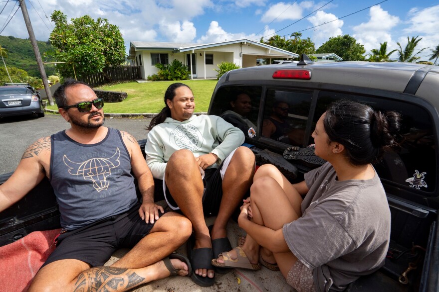 Kimeona Kane rides with his nephew, Gabriel Shimaoka, and niece, Genesis Shimaoka, in the bed of his pickup truck, Friday, July 17, 2026, in Kailua, Hawaii.