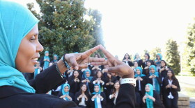 Mu Delta Alpha founder Samira Maddox makes the Delta sign with members of all MDA chapters, who gathered at UT-Dallas on Oct. 8, 2017. (Nida Rehman, courtesy Mu Delta Alpha)