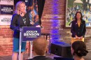 Michigan Secretary of State — and Democratic nominee for governor — Jocelyn Benson speaks at an event the day after the primary election as Governor Gretchen Whitmer looks on.