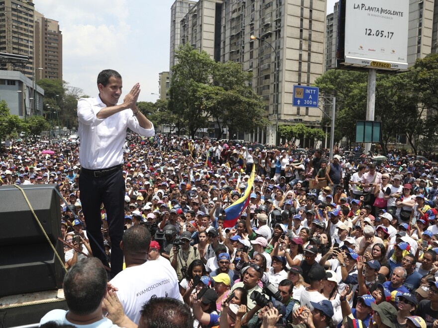 Opposition leader Juan Guaidó shows gratitude to supporters during a rally in Caracas, Venezuela, on Wednesday. Guaidó called for Venezuelans to fill streets around the country Wednesday to demand President Nicolas Maduro's ouster.