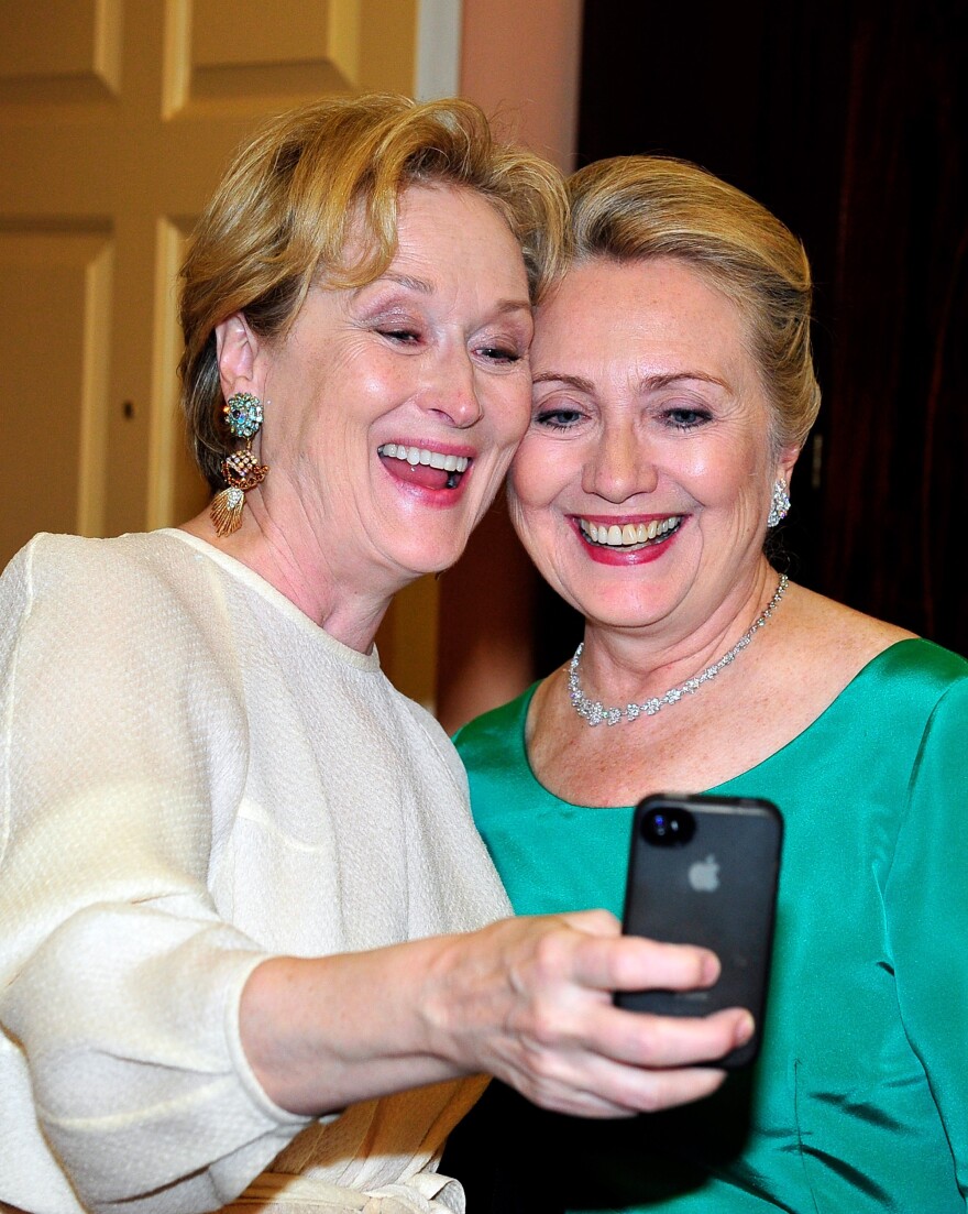 Actress Meryl Streep takes a photo of herself with then-Secretary of State Hillary Clinton in Washington last December.