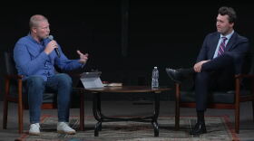 Pastor Phil McKay (left), with Turning Point USA founder Charlie Kirk at Calvary Chapel Reno Sparks in Nov. 2023. An expert in federal tax law told KUNR both men violated IRS rules by endorsing former president Donald Trump that night.