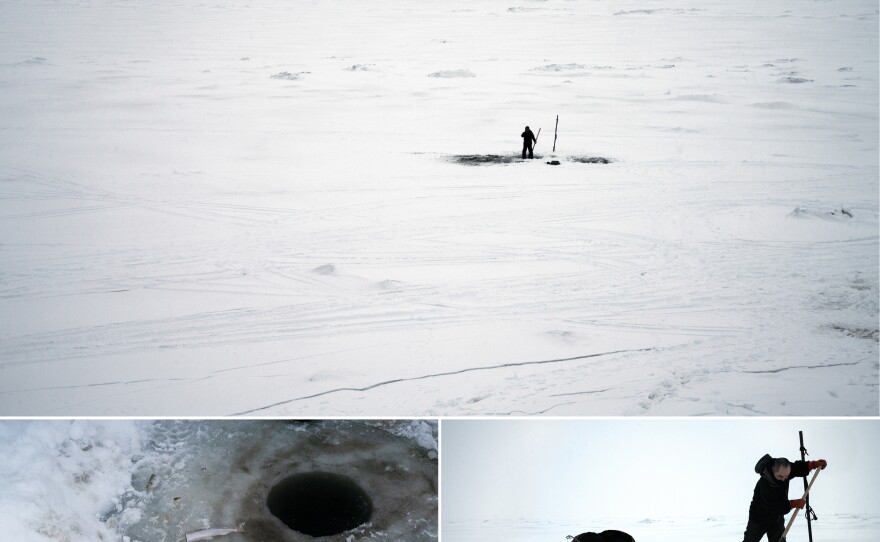 Top: Mick Chakuchin stands on the ice at the edge of Toksook Bay to fish for smelt. Left: Part of a bait fish at the edge of an ice fishing hole. Right: Chakuchin and his uncle, Jackie Woods, work on opening and keeping open holes in the ice from which they hope to catch smelts.