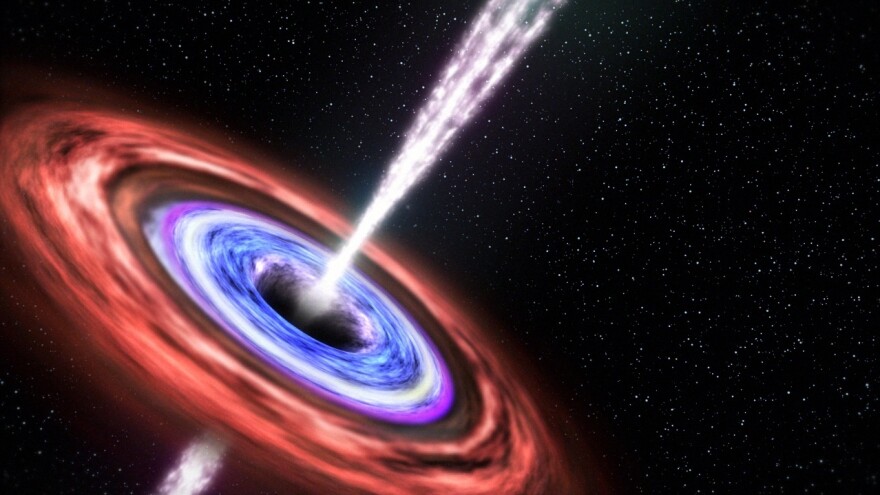 An artist's rendering depicts what happened when a black hole devoured a star in 2011 and ejected some of the stellar remains in a jet of particles pointed at Earth. This blazing quasar, or "blazar," was far enough away that it posed no harm to Earthlings.