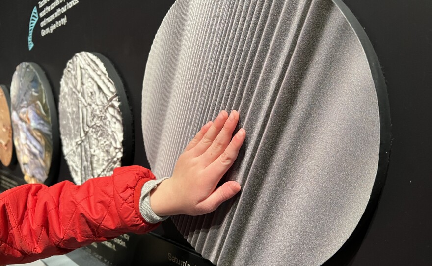 A tactile exhibit explains the surfaces of stellar bodies at Astronomy Discovery Center at Lowell Observatory on Nov. 16, 2024.