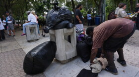 People living with homelessness in Fort Lauderdale's Downtown Stranahan Park are used to keeping their clothes for job interviews, blankets, personal documents and other belongings, in bags and under tarps inside the park square.