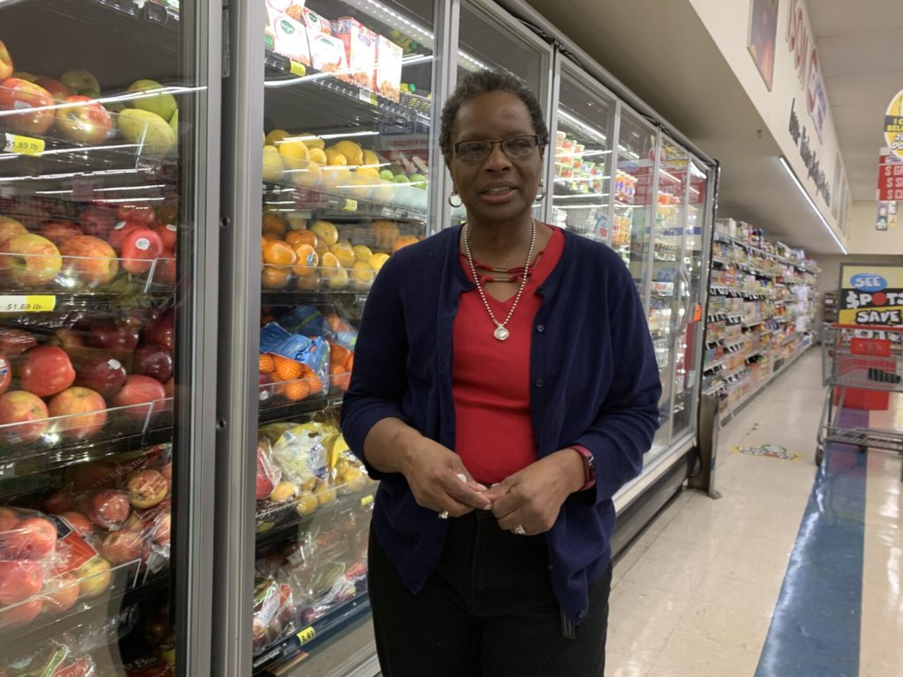 Gwen Christon with the new coolers that keep her energy bills low at the Isom, KY, IGA.