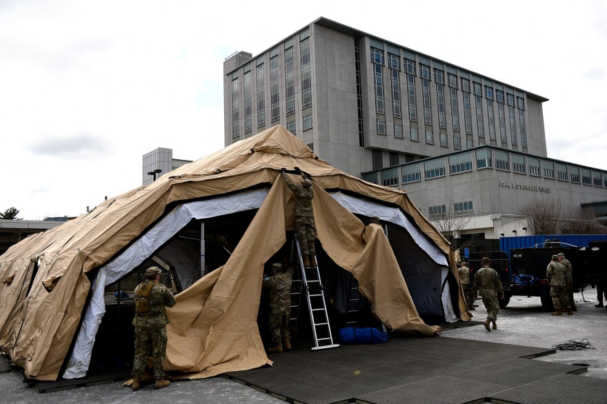 HARTFORD, CT - March 24, A mobile field hospital being erected by the Governor’s Foot and Horse Guard on the grounds of Saint Francis Hospital on March 24, 2020 in Hartford, Connecticut. 