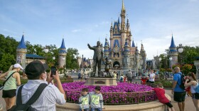 People visit the Magic Kingdom Park at Walt Disney World Resort in Lake Buena Vista, Fla., April 18, 2022. Ongoing strength at its theme parks and an improving streaming business propelled The Walt Disney Co. to higher profits and revenue in its fiscal second quarter in 2023