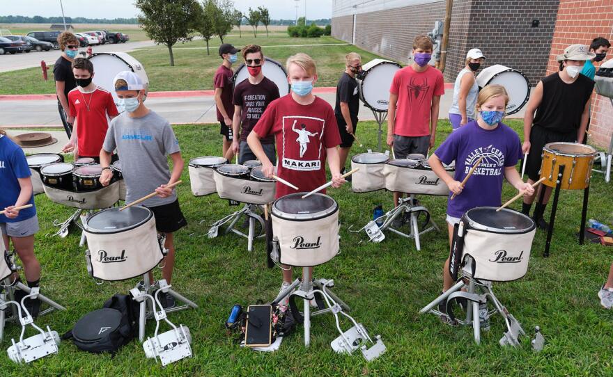 Masked band members try to keep their distance during band camp at Valley Center High School.(Photo by Brian Grimmett, Kansas News Service)