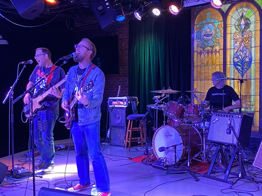 a band performing live heavy purple 