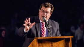 Larry Dietz speaking at a podium