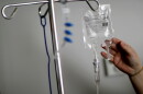 A nurse hooks up an IV to a flu patient at Upson Regional Medical Center in Thomaston, Ga., Feb. 9, 2018.