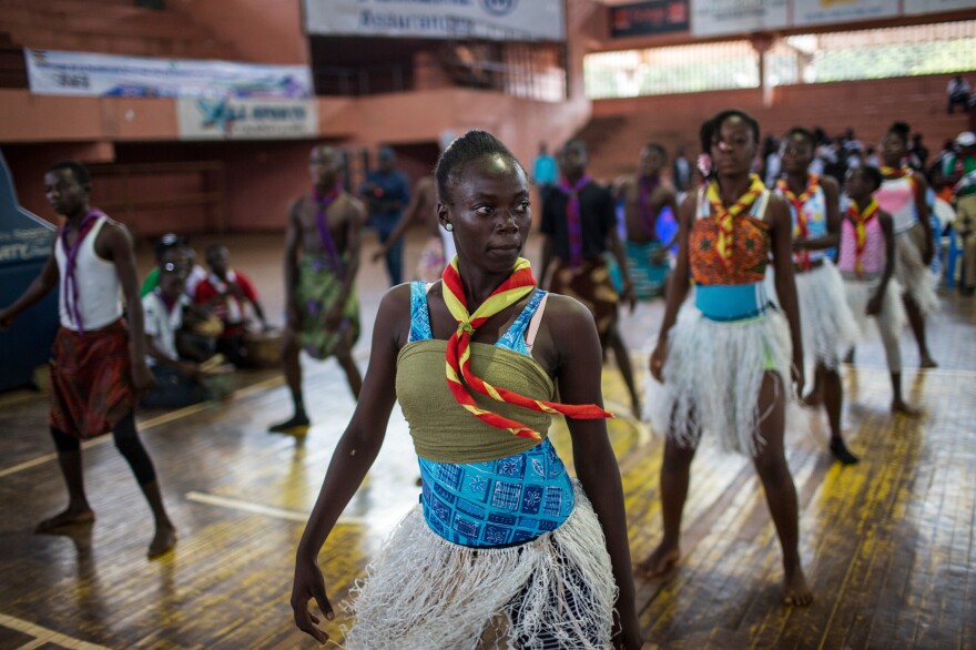 The scouting groups in the Central African Republic are now working to recruit female members. Above: Scouts perform a dance routine during a youth event in Bangui.