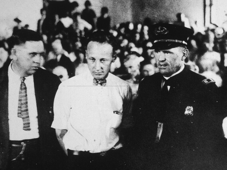 Scopes (center), a high school science teacher, was put on trial for teaching Darwin's theory of evolution, an act that was illegal. He was convicted and fined $100, but the verdict was overturned on appeal.