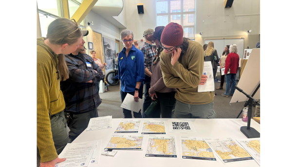At the March 11 meeting in Eagle, local trail users looked at maps of trails that would be affected by the BLM’s proposed e-bike land use change. Hilary Boyd, assistant manager for resources for the Colorado River Valley Field Office, was on hand to answer questions. Photo by Betsy Welch